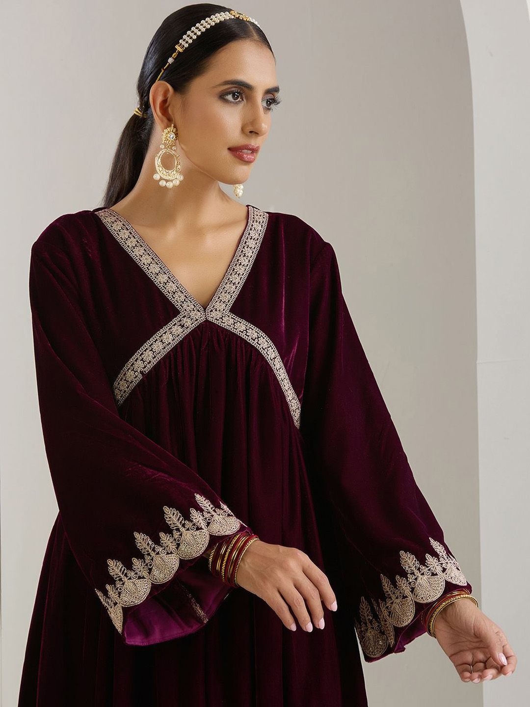 Rich Velvet Gold Zari Embroidered Purple A-Line Kurta Set with Straight Bottom & Scalloped Sleeves.