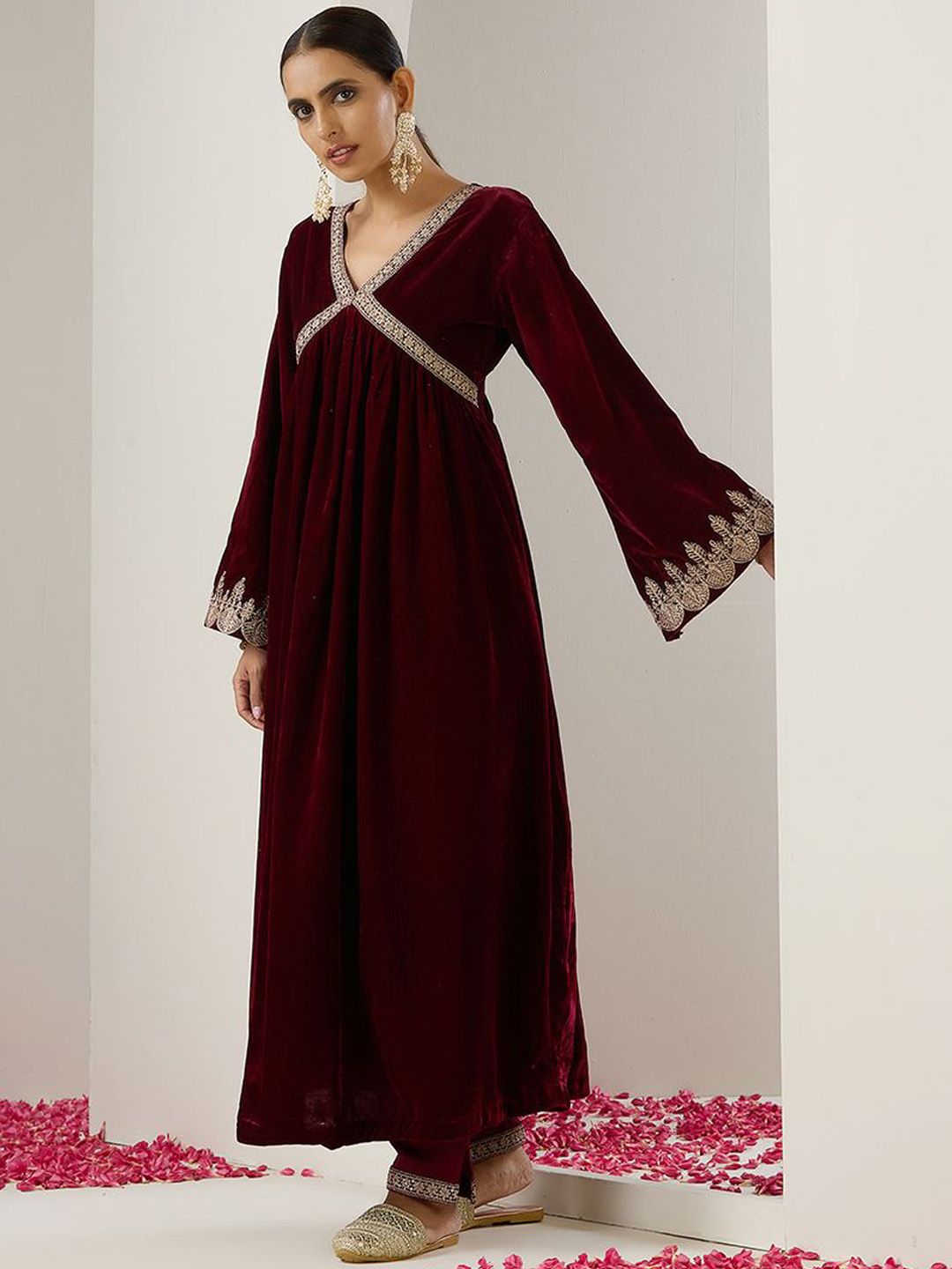 Rich Velvet Gold Zari Embroidered Burgundy A-Line Kurta Set with Straight Bottom & Scalloped Sleeves.