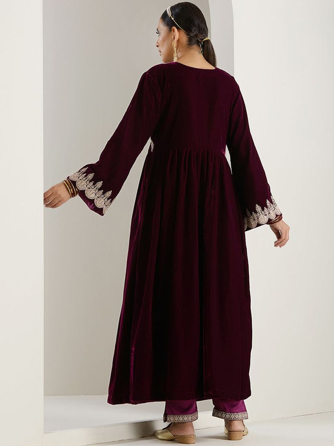 Rich Velvet Gold Zari Embroidered Purple A-Line Kurta Set with Straight Bottom & Scalloped Sleeves.