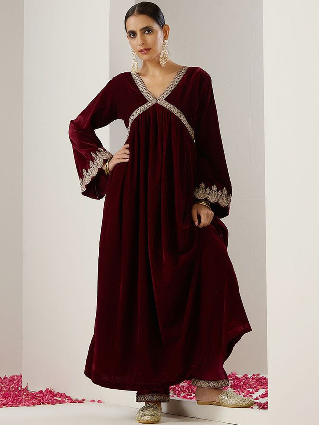 Rich Velvet Gold Zari Embroidered Burgundy A-Line Kurta Set with Straight Bottom & Scalloped Sleeves.