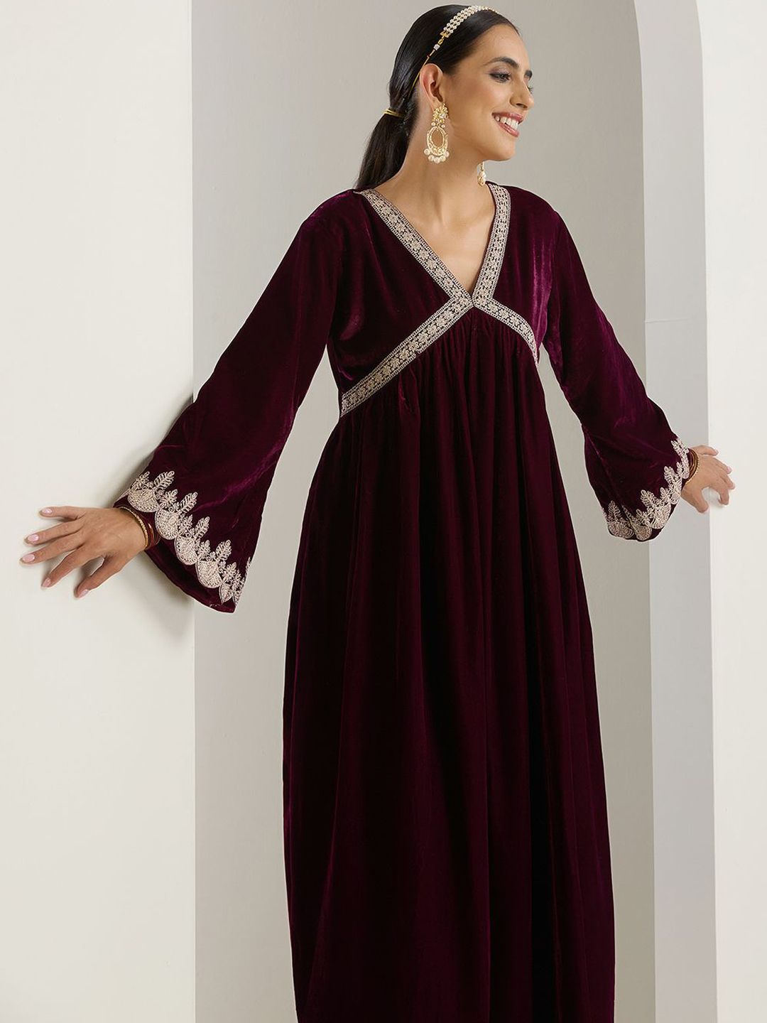 Rich Velvet Gold Zari Embroidered Purple A-Line Kurta Set with Straight Bottom & Scalloped Sleeves.