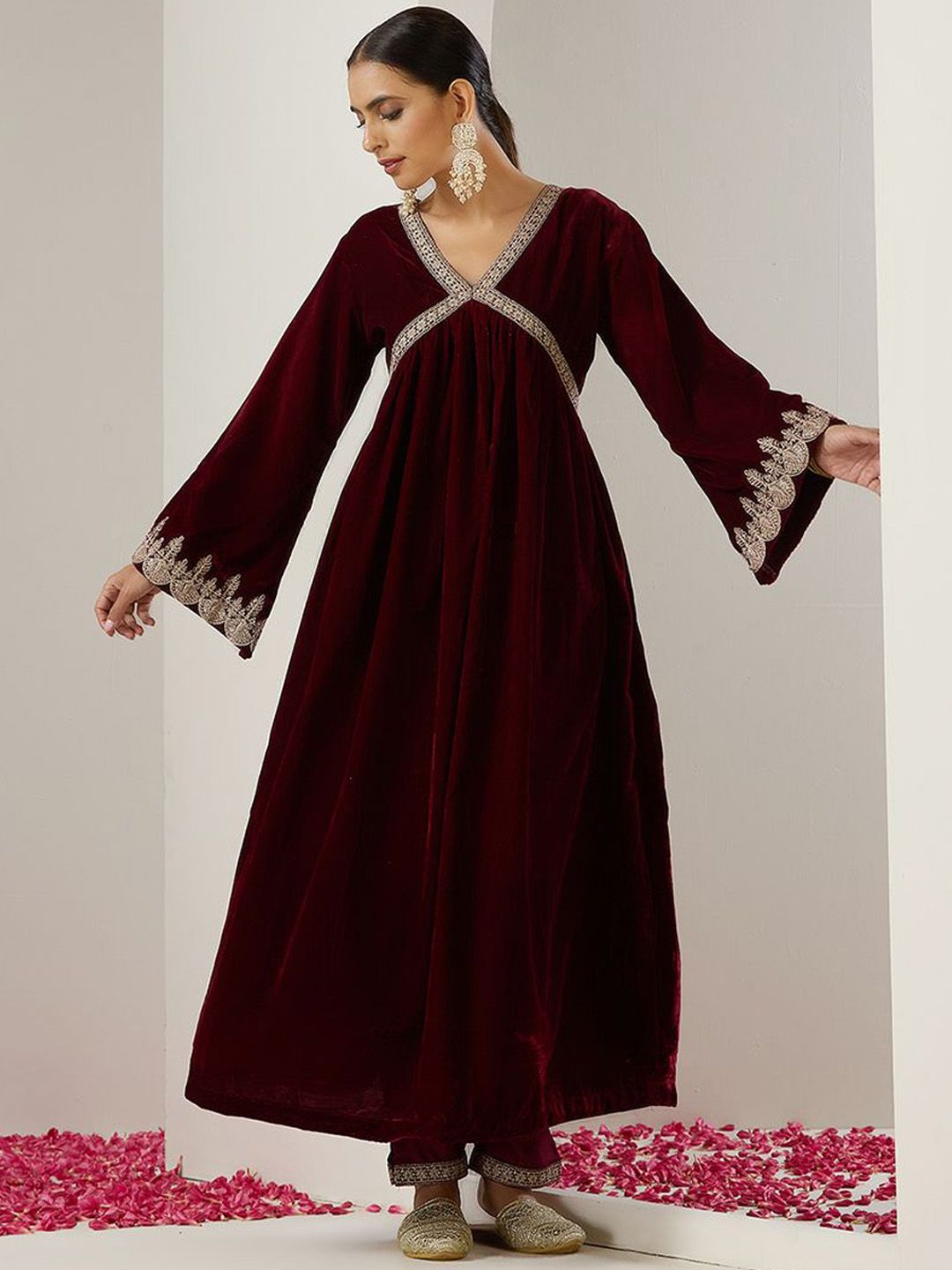 Rich Velvet Gold Zari Embroidered Burgundy A-Line Kurta Set with Straight Bottom & Scalloped Sleeves.