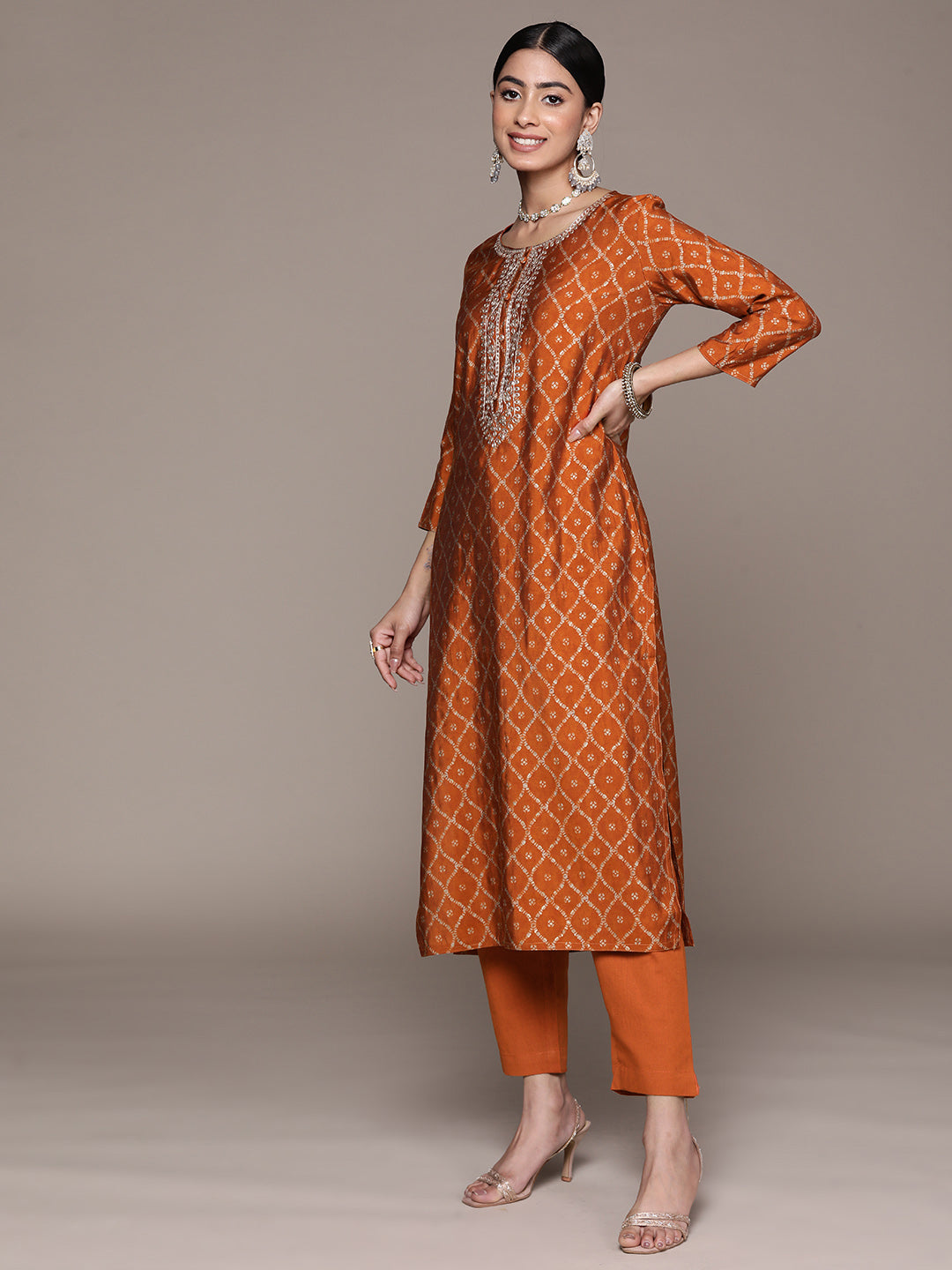 Ishin Women's Orange Embroidered Zari Flared Kurta Set with Pants & with Dupatta 