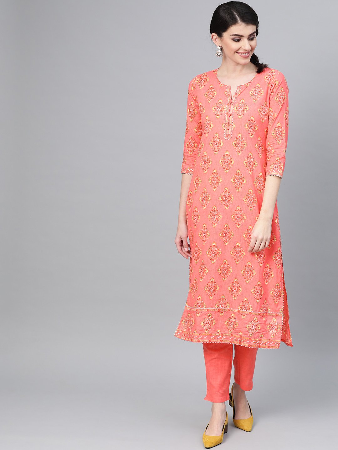 Ishin Women's Cotton Peach Embroidered A-Line Kurta Trouser Set